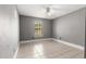 Cozy bedroom with a large window that lets in natural light and tile flooring for easy cleaning at 5580 Se 21St Ln, Ocala, FL 34480