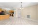 Dining room with tile floor, chandelier lighting, and doorway at 5580 Se 21St Ln, Ocala, FL 34480