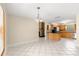 Dining room with open access to kitchen and stone fireplace at 5580 Se 21St Ln, Ocala, FL 34480