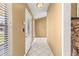 Inviting foyer with tile flooring, a decorative door, and neutral-colored walls at 5580 Se 21St Ln, Ocala, FL 34480