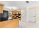 Kitchen features wooden cabinets, black appliances, and tile flooring at 5580 Se 21St Ln, Ocala, FL 34480