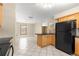 Kitchen with black appliances and wooden cabinetry at 5580 Se 21St Ln, Ocala, FL 34480