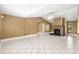 Spacious living room with tiled floors and a stone fireplace, perfect for Gathering gatherings at 5580 Se 21St Ln, Ocala, FL 34480