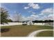 Fenced backyard with a shed featuring railroad crossing signs and decorative railroad-themed decor at 6365 Se 12Th Ln, Ocala, FL 34472