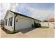 Spacious two-car garage featuring white siding, black shutters and a well-maintained driveway at 6365 Se 12Th Ln, Ocala, FL 34472