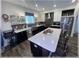 Modern kitchen featuring stainless steel appliances, black cabinets, white countertops and island seating at 6365 Se 12Th Ln, Ocala, FL 34472