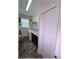 Laundry room featuring a washer and dryer with dark cabinetry, and shelving at 6365 Se 12Th Ln, Ocala, FL 34472
