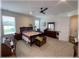 Comfortable main bedroom with carpet flooring, neutral tones, and natural light, creating a serene and inviting personal space at 6365 Se 12Th Ln, Ocala, FL 34472