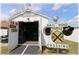 Open outbuilding showing street names, rail road sign, black ramp, and some stored tools at 6365 Se 12Th Ln, Ocala, FL 34472