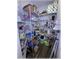 Well-stocked walk-in pantry with ample shelving for organized storage and convenience, ensuring a clutter-free kitchen at 6365 Se 12Th Ln, Ocala, FL 34472