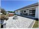 Covered patio with outdoor seating, a ceiling fan, and a view of the expansive, fenced backyard at 6365 Se 12Th Ln, Ocala, FL 34472