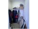 Functional storage closet with shelves, clothing racks, and space for storing various items at 6365 Se 12Th Ln, Ocala, FL 34472