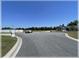 Well maintained street view showing large lots, manicured lawns, and attractive landscaping at 6365 Se 12Th Ln, Ocala, FL 34472