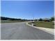 Street view of neighborhood with manicured lawns, sidewalks, and well maintained homes at 6365 Se 12Th Ln, Ocala, FL 34472