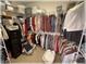 Spacious walk-in closet with extensive shelving and hanging rods, offering generous storage solutions for an organized wardrobe at 6365 Se 12Th Ln, Ocala, FL 34472