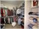 Well-organized walk-in closet with shelving and hanging space, providing ample storage for clothes and accessories at 6365 Se 12Th Ln, Ocala, FL 34472