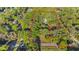 Aerial view of the property highlighting land's boundaries and surrounding lush greenery at 6700 Nw 57Th Ave, Ocala, FL 34482