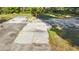 Backyard shows concrete pads and aged playground equipment at 6700 Nw 57Th Ave, Ocala, FL 34482