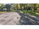 Long driveway leads to property with mature trees and grass yard at 6700 Nw 57Th Ave, Ocala, FL 34482