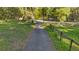 Open, grassy yard enclosed by a rustic wooden fence, providing ample outdoor space at 6700 Nw 57Th Ave, Ocala, FL 34482
