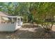 The spacious backyard includes a screened-in porch, providing a serene outdoor retreat at 712 Harper Pl, Lady Lake, FL 32159