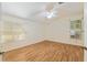 Light-filled bedroom featuring wood floors and natural light at 712 Harper Pl, Lady Lake, FL 32159