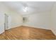 Neutral bedroom with ceiling fan and two windows providing natural light at 712 Harper Pl, Lady Lake, FL 32159