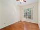 Cozy bedroom featuring hardwood floors and a large window offering ample natural light at 712 Harper Pl, Lady Lake, FL 32159