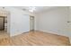 Spacious bedroom features wood look vinyl flooring and ensuite bath access at 712 Harper Pl, Lady Lake, FL 32159