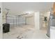 Spacious two-car garage with ample storage space and overhead lighting at 712 Harper Pl, Lady Lake, FL 32159