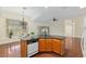 Eat-in kitchen with granite island, adjacent to a large living area at 712 Harper Pl, Lady Lake, FL 32159