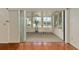Enclosed lanai filled with natural light from the large windows and sliding glass doors at 712 Harper Pl, Lady Lake, FL 32159
