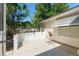Outdoor patio area with room for seating and lush landscaping at 712 Harper Pl, Lady Lake, FL 32159