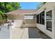 Outdoor patio with room for table and small garden at 712 Harper Pl, Lady Lake, FL 32159