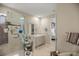 Bright bathroom featuring a shower with glass door, large mirror above the sink and custom cabinets at 7687 Sw 63Rd Place Rd, Ocala, FL 34474