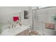 Bright bathroom featuring a walk-in shower with glass door, modern fixtures, and contemporary vanity at 7687 Sw 63Rd Place Rd, Ocala, FL 34474