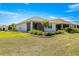 Well-manicured backyard with a screened lanai provides a comfortable outdoor living space at 7696 Sw 86Th Ct, Ocala, FL 34481