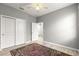 Empty bedroom with closet space, neutral walls, and wood-look floors awaiting personalization at 7696 Sw 86Th Ct, Ocala, FL 34481