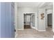 Bright and inviting foyer with views to office and open living area shows off tile floors at 7696 Sw 86Th Ct, Ocala, FL 34481