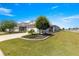 Landscaped front yard with a well-maintained lawn and inviting curb appeal enhances this charming single-story home at 7696 Sw 86Th Ct, Ocala, FL 34481