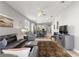 Open-concept living room with view of kitchen offers ample seating and stylish decor, great for entertaining at 7696 Sw 86Th Ct, Ocala, FL 34481