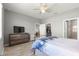 Bright main bedroom with walk-in closet and ensuite bathroom featuring a tiled shower at 7696 Sw 86Th Ct, Ocala, FL 34481