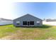 The home boasts a large backyard, featuring a screened in porch perfect for enjoying the outdoors at 8004 Juniper Rd, Ocala, FL 34480