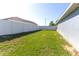 A large backyard with full privacy fence and access gate, perfect for entertaining and relaxing outdoors at 8004 Juniper Rd, Ocala, FL 34480