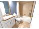 Cozy bathroom featuring a tub, toilet, sink, and vanity with tile flooring at 8004 Juniper Rd, Ocala, FL 34480