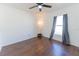 Bright bedroom with modern ceiling fan, wood floors, and natural light from the window at 8004 Juniper Rd, Ocala, FL 34480