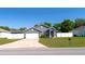 Charming single-Gathering home featuring a two-car garage, well-maintained lawn and clean landscaping at 8004 Juniper Rd, Ocala, FL 34480