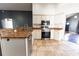 Updated kitchen with white cabinets and stainless steel appliances and fixtures at 8004 Juniper Rd, Ocala, FL 34480