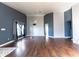 Spacious living room with dark hardwood floors, high ceilings and neutral paint scheme at 8004 Juniper Rd, Ocala, FL 34480