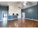 Spacious living room with hardwood floors, neutral paint, and an open concept to the kitchen at 8004 Juniper Rd, Ocala, FL 34480
